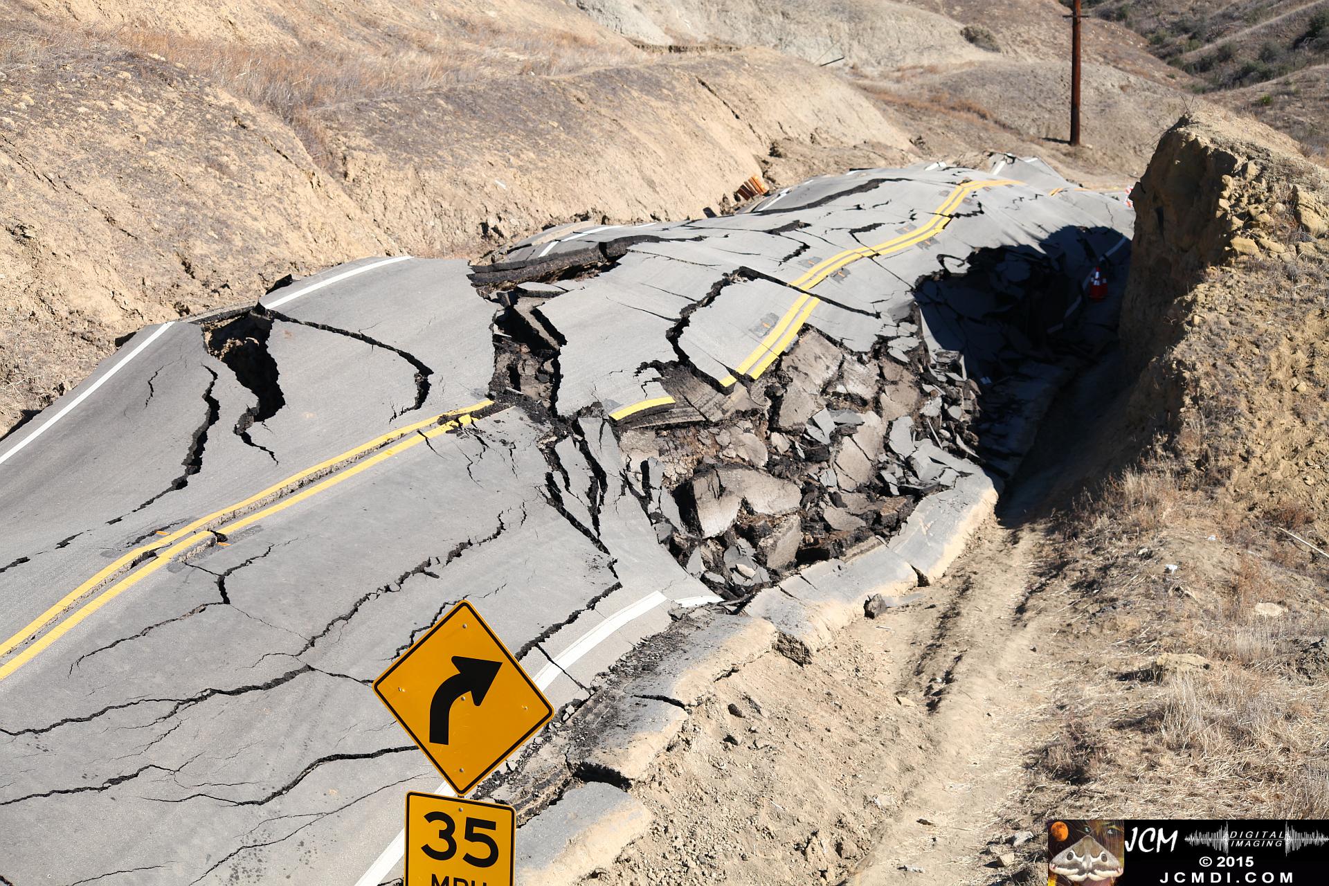 Landslide, buckled pavement, and terrain at Vasquez Canyon Road in Santa Clarita, CA filmed 11-25-2015